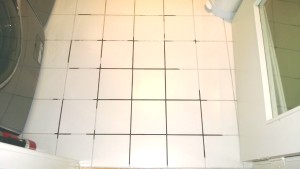 repairing the grout in the laundry room
