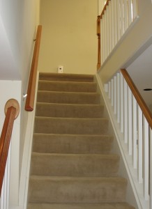 stairs with old wall to wall carpet