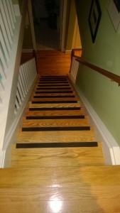 new hardwood and tread riser grips on stairs
