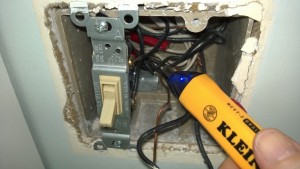 testing for voltage while replacing the bathroom light switch with a timer
