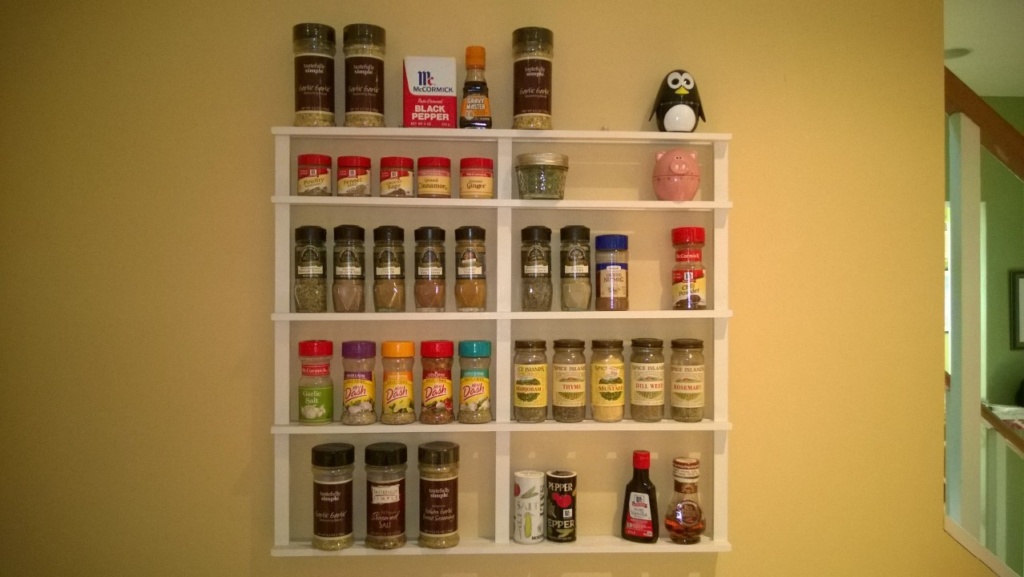 DIY spice rack on kitchen wall