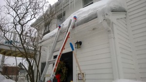 putting diy ice dam roof ice melters on the roof during snowmageddon 2015