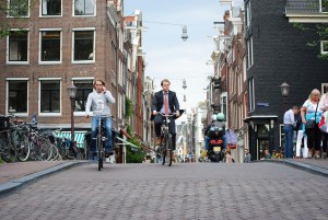 watching people commuting by bicycle in amsterdam