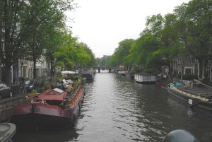 canal with house boats in amsterdam