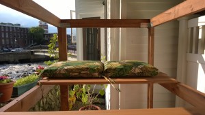 outdoor cat enclosure / catio cushions, ipswich river and riverwalk in background