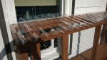 bolting the polycarbonate roof panels to the outdoor cat enclosure / catio