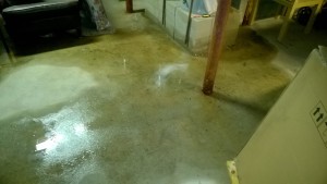 basement floor is wet from hot water heat leak