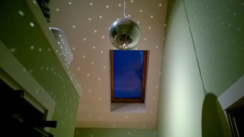 disco ball and reflections / sparkles / polka dots in the upstairs hallway