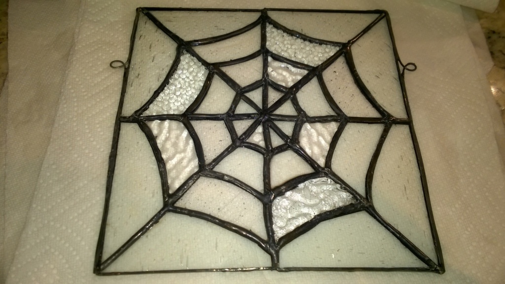 adding reinforced hooks to the side of the stained glass spider web