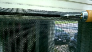 using spline and a spline roller to attach the front hall replacement screen