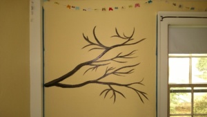 cherry blossom branch i painted on abbie's twins' bedroom wall before blossoms