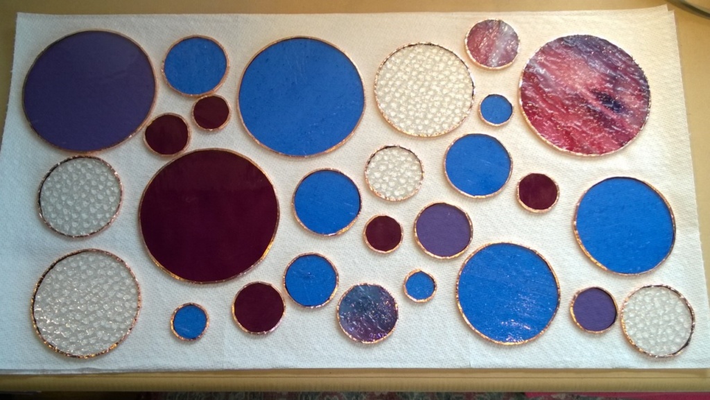 today i foiled and soldered the edges of my 27 stained glass circles