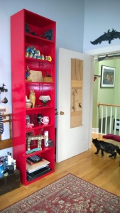 the tall red bookcase in the girl cave is all put back together