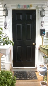 i painted our neighbor's door black to match the rest of the condo doors