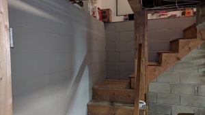 i painted drylok masonry waterproofer on the walls going up the basement stairs