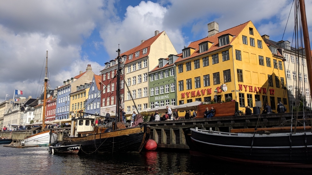 painted buildings and houseboats at nyhavn waterfront, copenhagen
