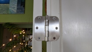 the silver nickel colored hinges in the french doors in the living room