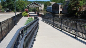 a view of the ipswich riverwalk from the bridge