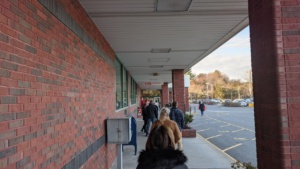 the new normal - waiting in line to enter market basket rowley
