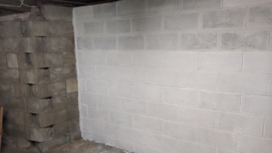 painting the 2nd coat of drylok waterproofing sealant on the basement wall
