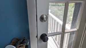 the baldwin smartkey deadbolt & doorknob in the bedroom door - silver nickel brass